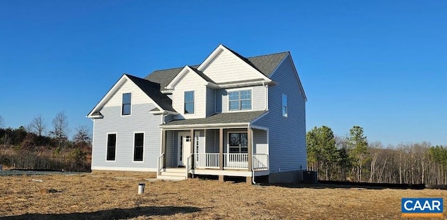 view of front facade with covered porch and cooling unit