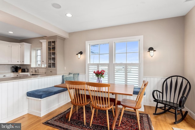 dining area with light hardwood / wood-style floors