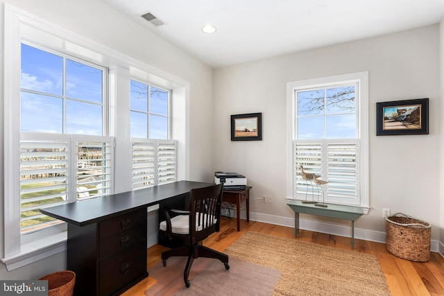 office space featuring light wood-type flooring