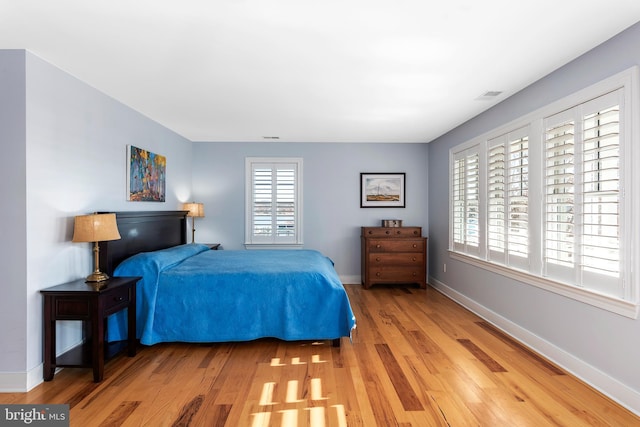 bedroom featuring wood-type flooring