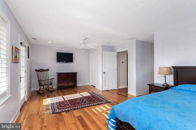 bedroom with hardwood / wood-style flooring and ceiling fan