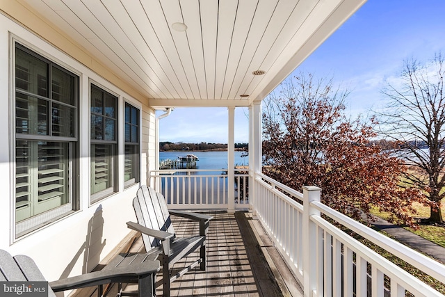 balcony featuring a water view