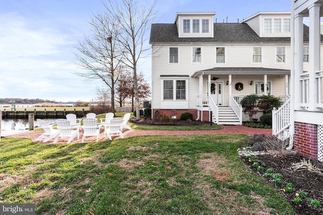 view of front of property featuring a water view and a front yard