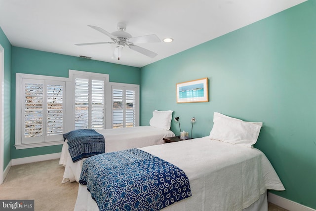 bedroom with light colored carpet and ceiling fan