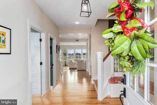 hallway featuring light hardwood / wood-style flooring