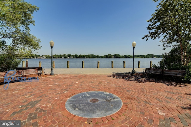 view of patio featuring a water view