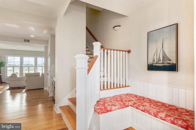 stairs with hardwood / wood-style floors