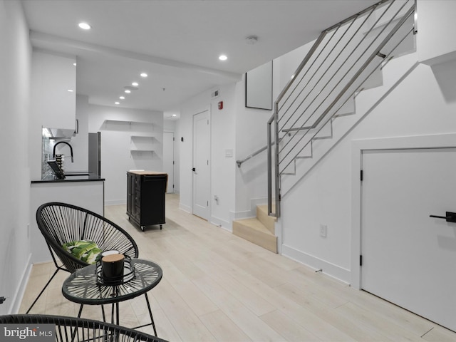 interior space with sink and wood-type flooring