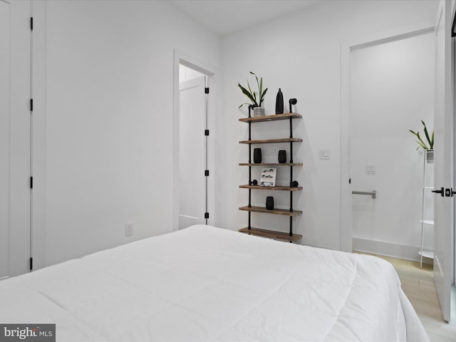 bedroom with light wood-type flooring