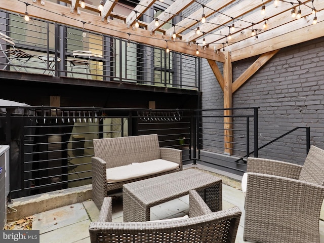 view of patio / terrace featuring a pergola and a balcony