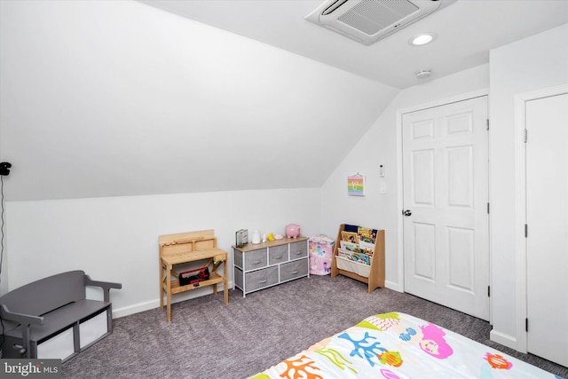 playroom featuring dark colored carpet and lofted ceiling