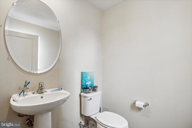 bathroom with sink and toilet