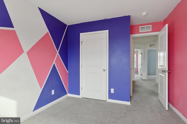 unfurnished bedroom featuring carpet flooring