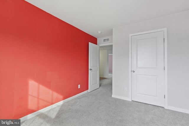 unfurnished bedroom with light carpet