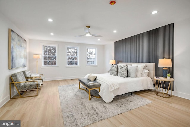 bedroom featuring light hardwood / wood-style floors and ceiling fan