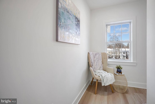 sitting room with hardwood / wood-style floors