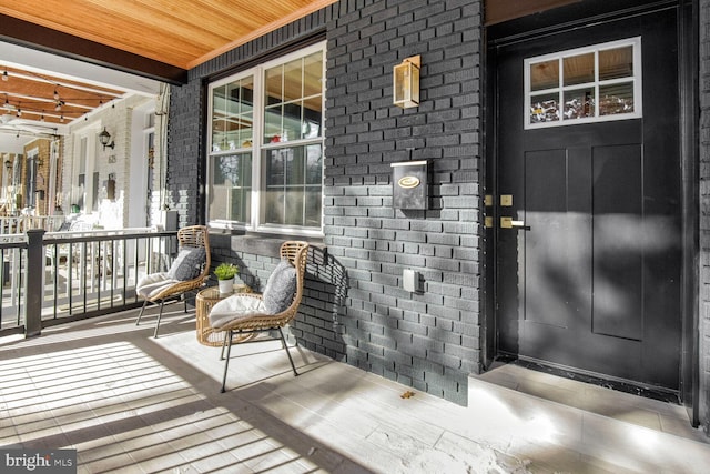 entrance to property featuring a porch