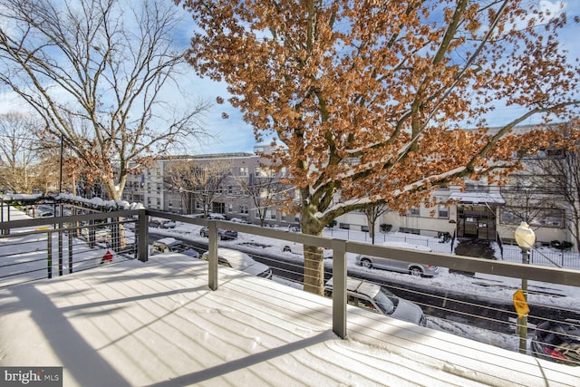 view of snow covered deck