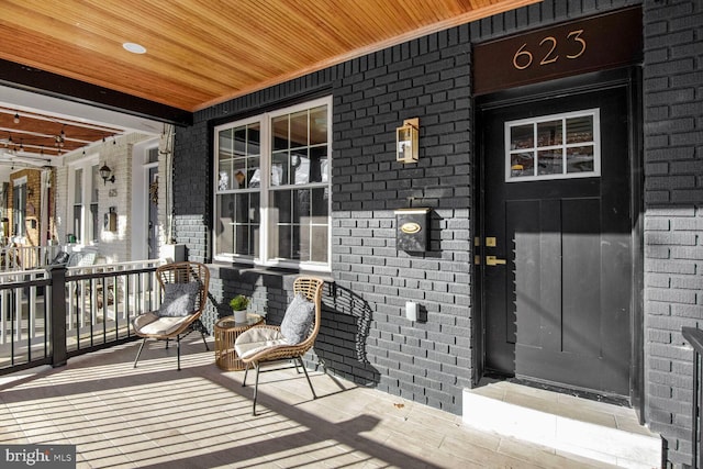 doorway to property with covered porch