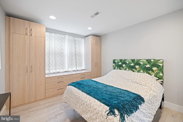 bedroom featuring light hardwood / wood-style floors