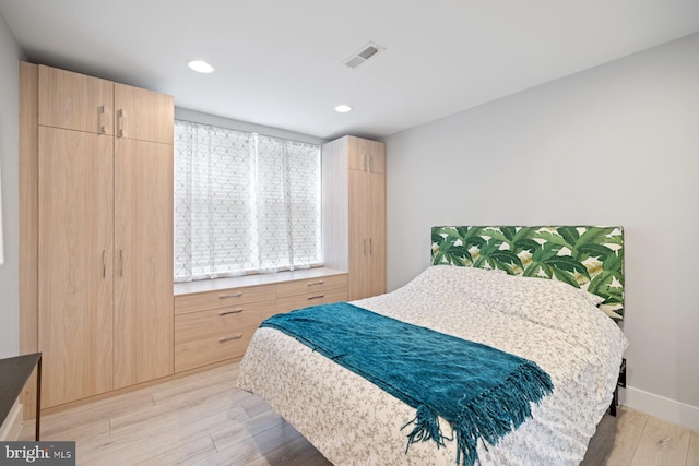 5024 9th St NW Unit 301, Washington, DC 20011 - bedroom featuring light wood-style flooring, baseboards, and recessed lighting