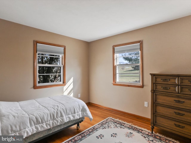 bedroom with light wood-type flooring