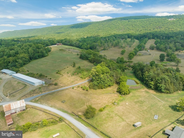 birds eye view of property with a rural view