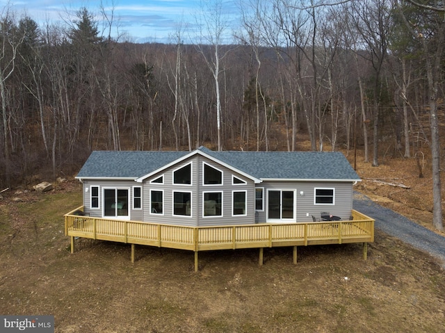 back of property featuring a deck