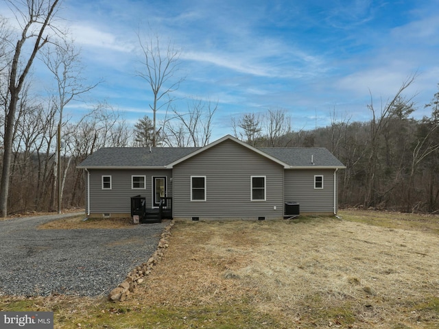 back of property featuring central AC unit