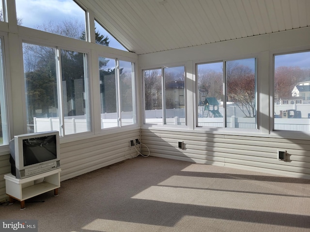 sunroom with lofted ceiling and a wealth of natural light