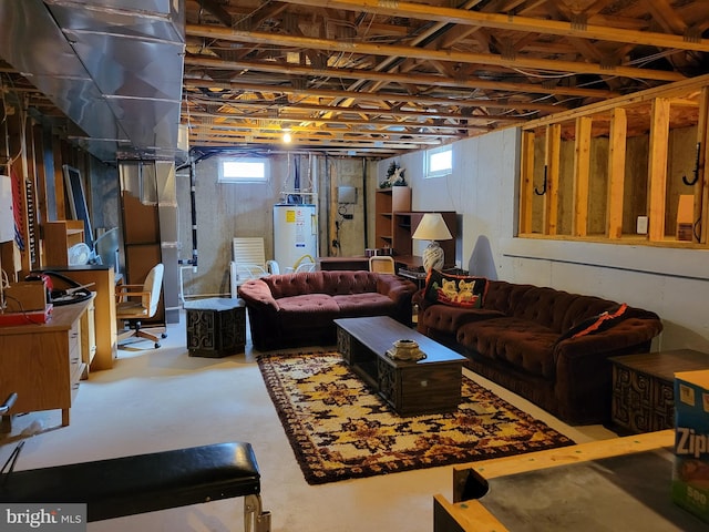 interior space featuring concrete flooring, a wealth of natural light, and water heater