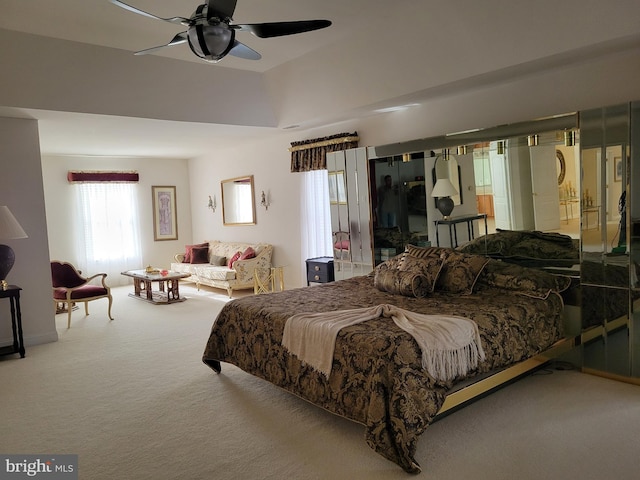 bedroom with ceiling fan and carpet floors