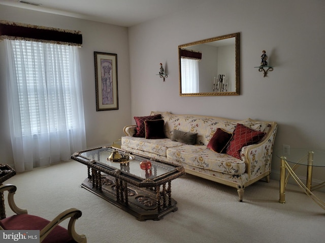 living room with a healthy amount of sunlight and carpet floors