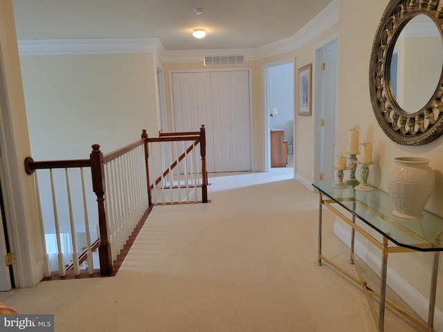 hallway with carpet and crown molding