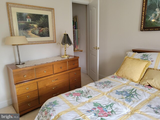 bedroom featuring light colored carpet