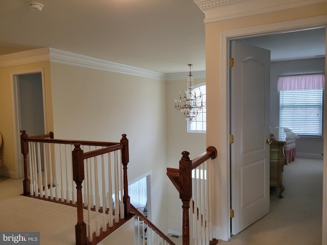 stairs with a wealth of natural light, carpet, and a chandelier