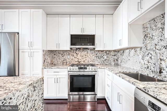 kitchen with sink, white cabinets, stainless steel appliances, and dark hardwood / wood-style floors