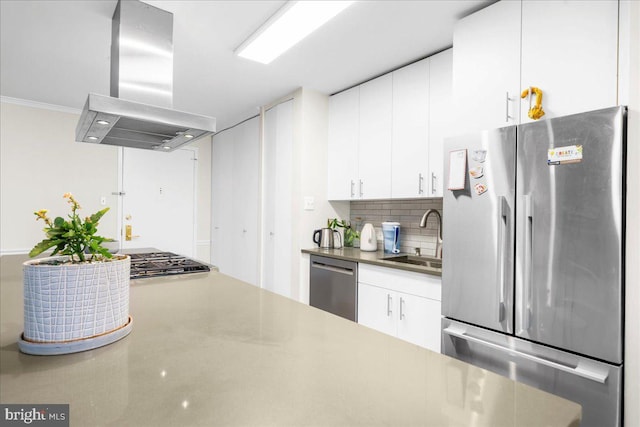 kitchen with island range hood, sink, white cabinets, and appliances with stainless steel finishes