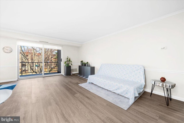 unfurnished room featuring crown molding and hardwood / wood-style flooring