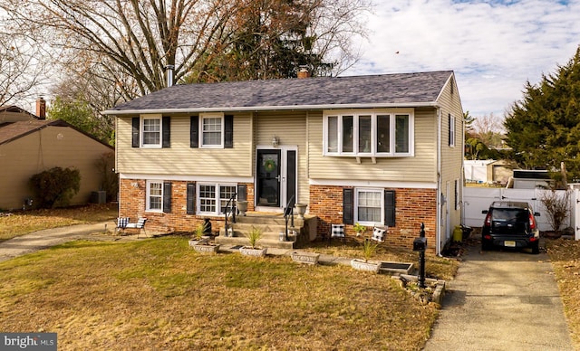 bi-level home with a front yard