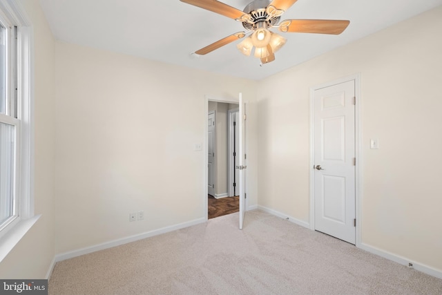 interior space featuring ceiling fan