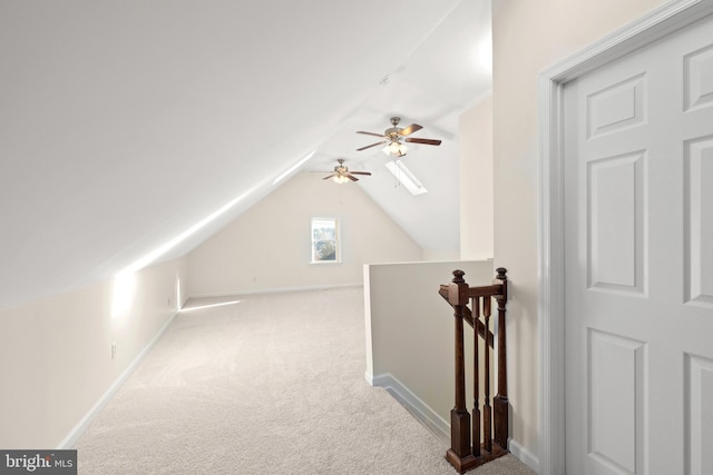 additional living space featuring carpet flooring, ceiling fan, and lofted ceiling