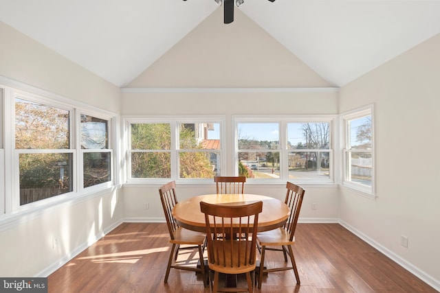 sunroom featuring ceiling fan and vaulted ceiling