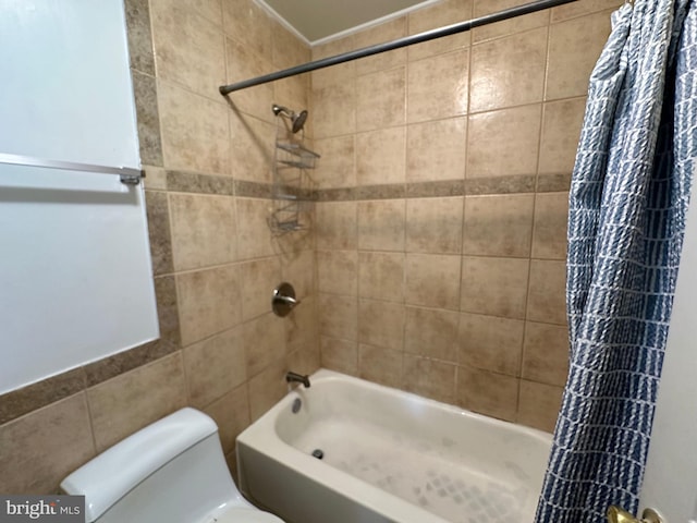 bathroom featuring shower / bathtub combination with curtain, tile walls, and toilet