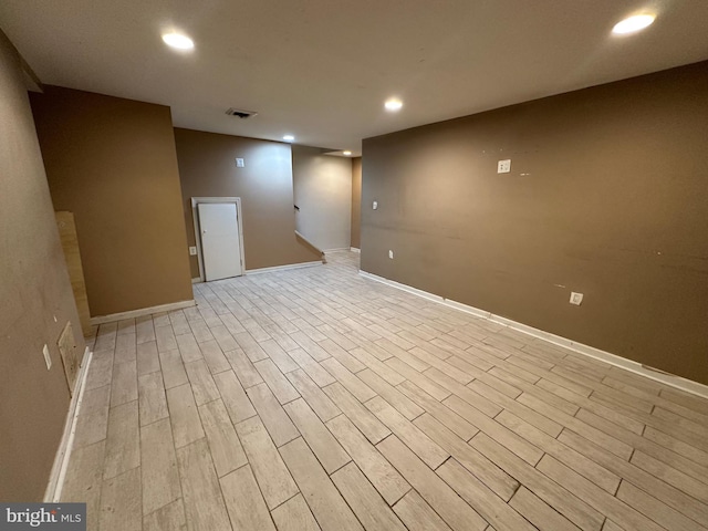 basement featuring light hardwood / wood-style flooring