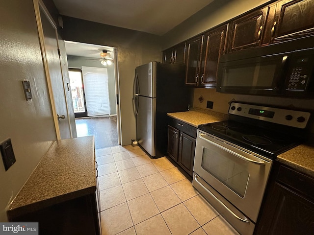 kitchen featuring ceiling fan, dark brown cabinets, light tile patterned floors, and stainless steel appliances