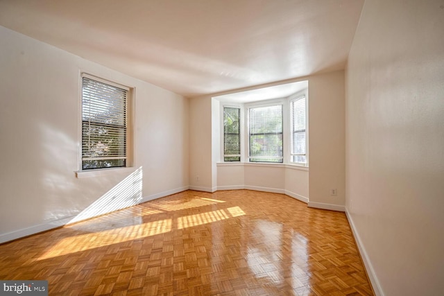 empty room with light parquet flooring