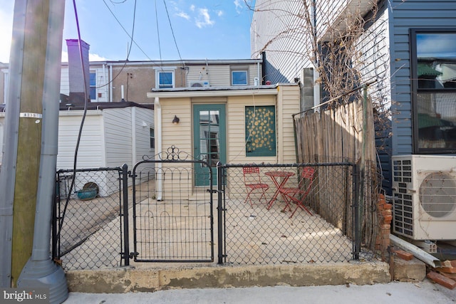 view of front of home with ac unit