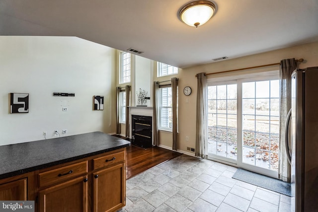 kitchen featuring light wood-type flooring and stainless steel refrigerator