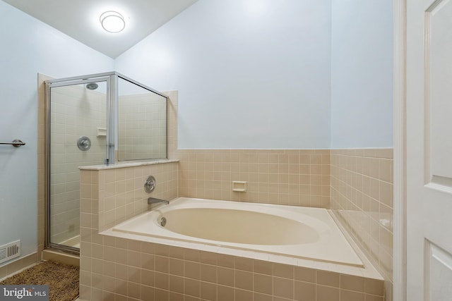 bathroom with plus walk in shower and vaulted ceiling